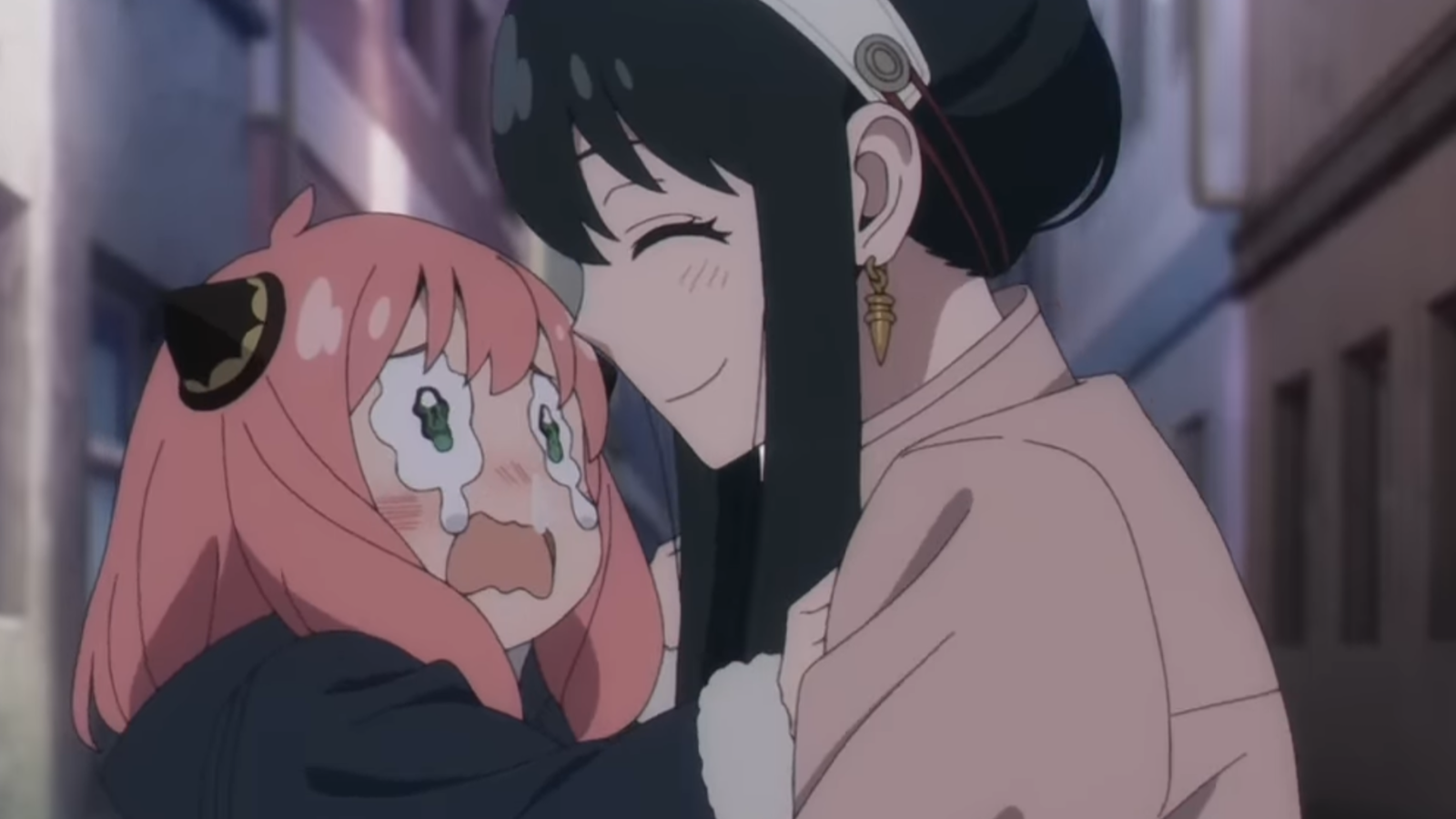 Yor is lovingly looking at Anya who’s crying in Spy X Family anime 