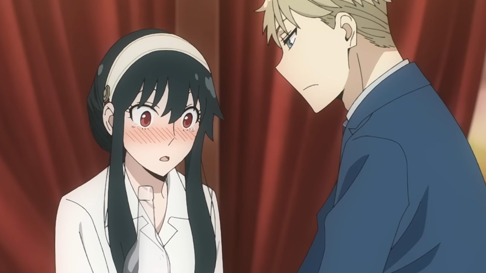 Yor is blushing while Loid is looking at her 