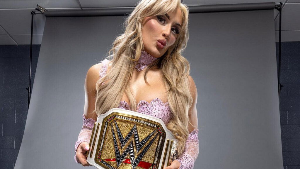 Tiffany Stratton flaunting her WWE Women's Championship.