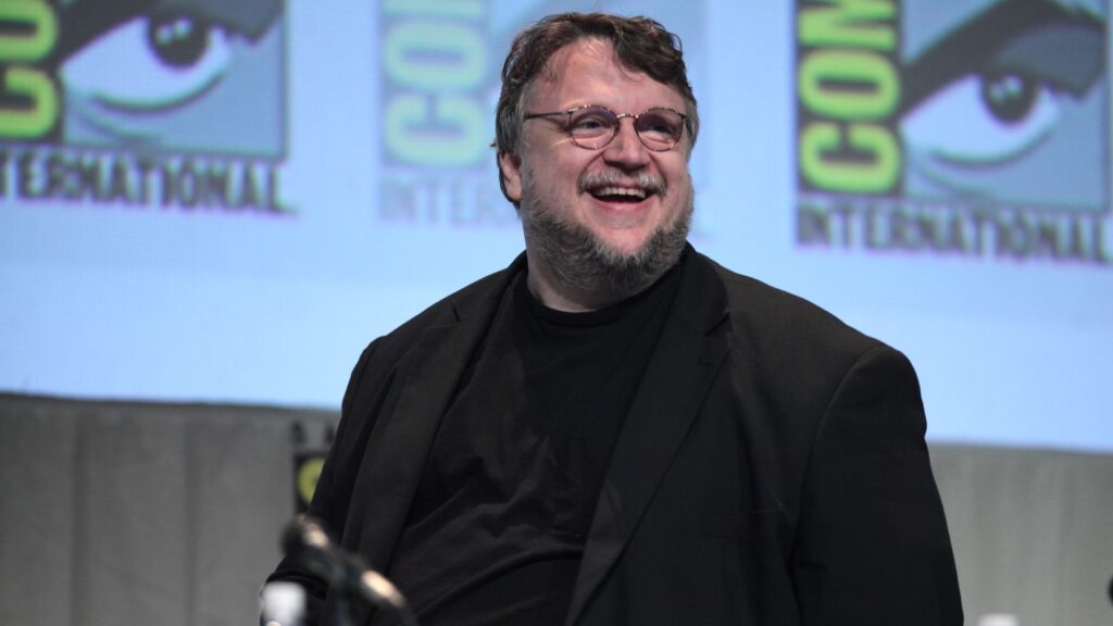 10 Most Successful Non-American Directors in Hollywood 4 Guillermo del Toro laughing enthusiastically at 2015 San Diego Comic Con International, for "The Strain." Comic-Con branding is visible on the blue backdrop behind him.