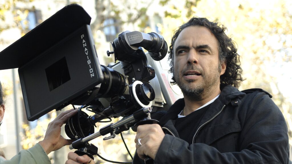 10 Most Successful Non-American Directors in Hollywood 9 Alejandro González Iñárritu behind a professional movie camera during an outdoor shoot.