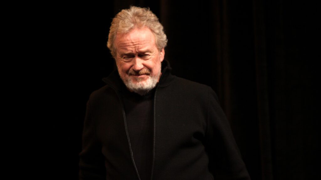 10 Most Successful Non-American Directors in Hollywood 11 Ridley Scott is photographed while wearing a black coat against a dark background. He has a serious expression and is at the 2012 WonderCon in Anaheim, California.