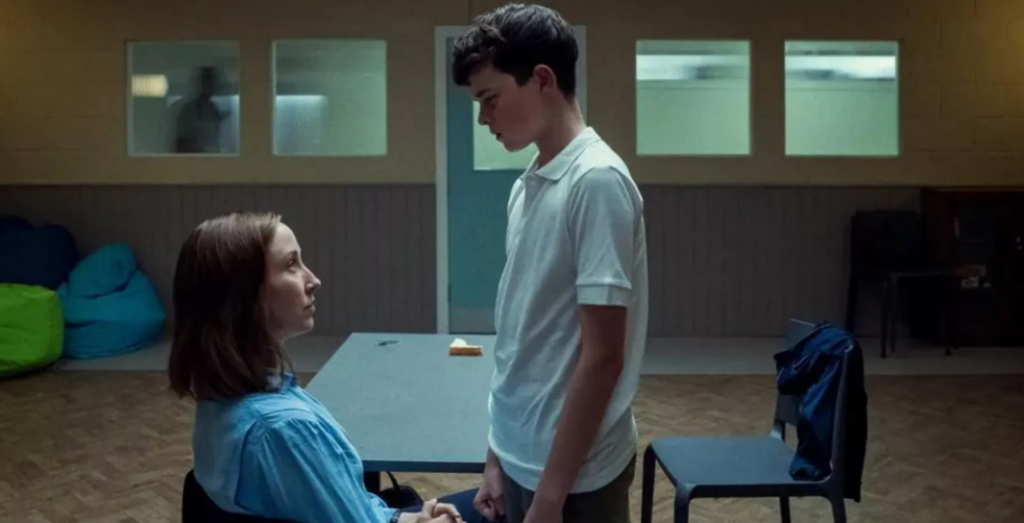Erin Doherty and Owen Cooper as Briony Ariston and Jamie Miller in the series Adolescence as Jamie gets into Briony's personal space trying to intimidate her.