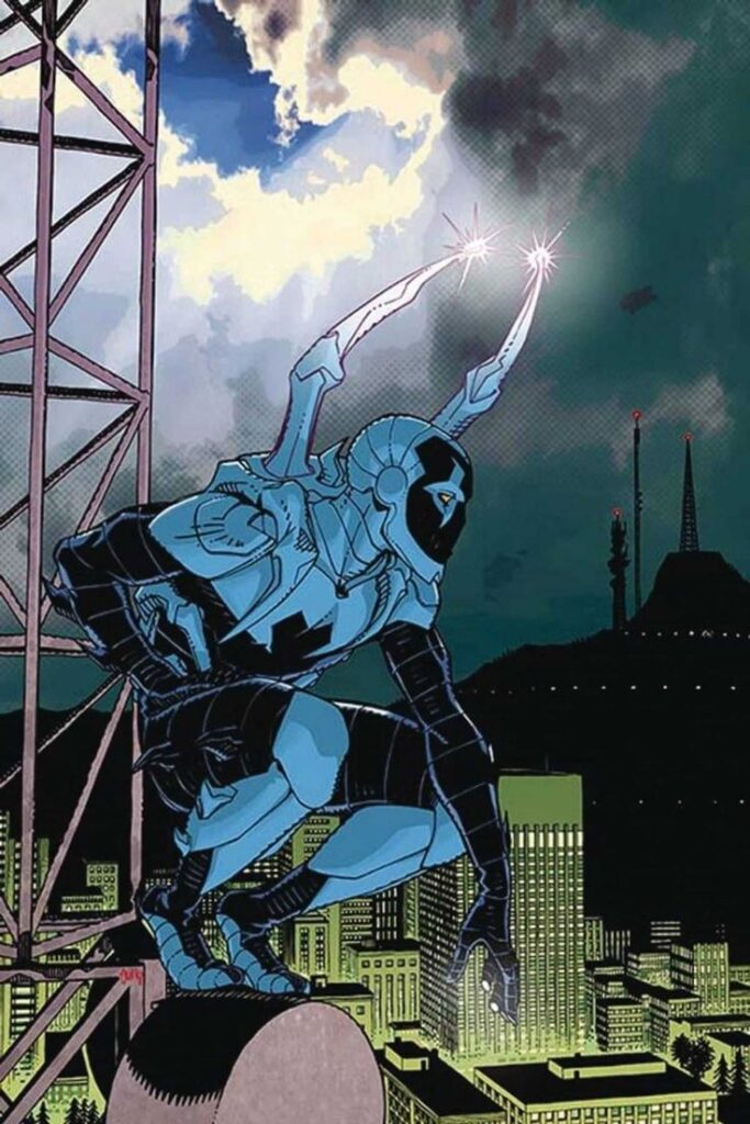 Blue Beetle on the top of a tower looking over the city