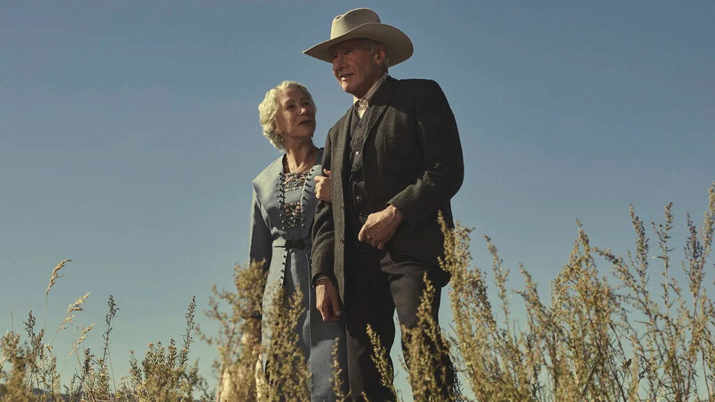 Helen Mirren and Harrison Ford in 1923 standing in a field