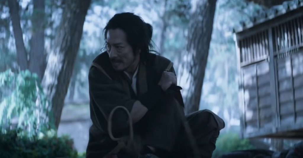 Mortal Kombat II Has to Avenge the First Film’s Biggest Sin 3 A still from Mortal Kombat 2021 featuring Hanzo Hasashi with a gardening tool.