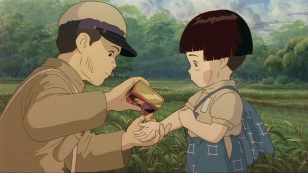 Seita giving Setsuko a candy in Grave of the Fireflies