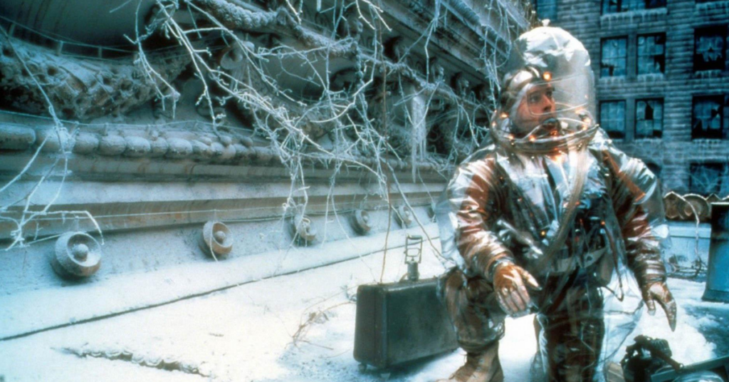 A scene from 12 Monkeys shows a person wearing a bulky suit.