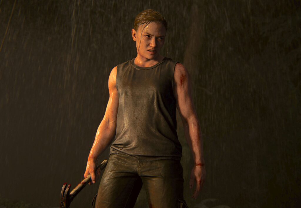 HBO’s ‘The Last of Us’ Season 2 Exposed an Ugly Truth About Joel and Abby's Saga Few Game Fans Noticed 2 Abby holding a bloodied hammer in the rain in a still from the last of us part ii.
