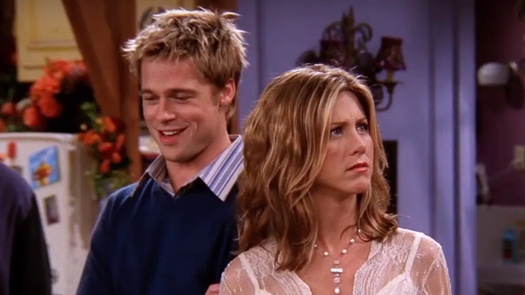 Brad Pitt behind Jennifer Aniston in a still from FRIENDS