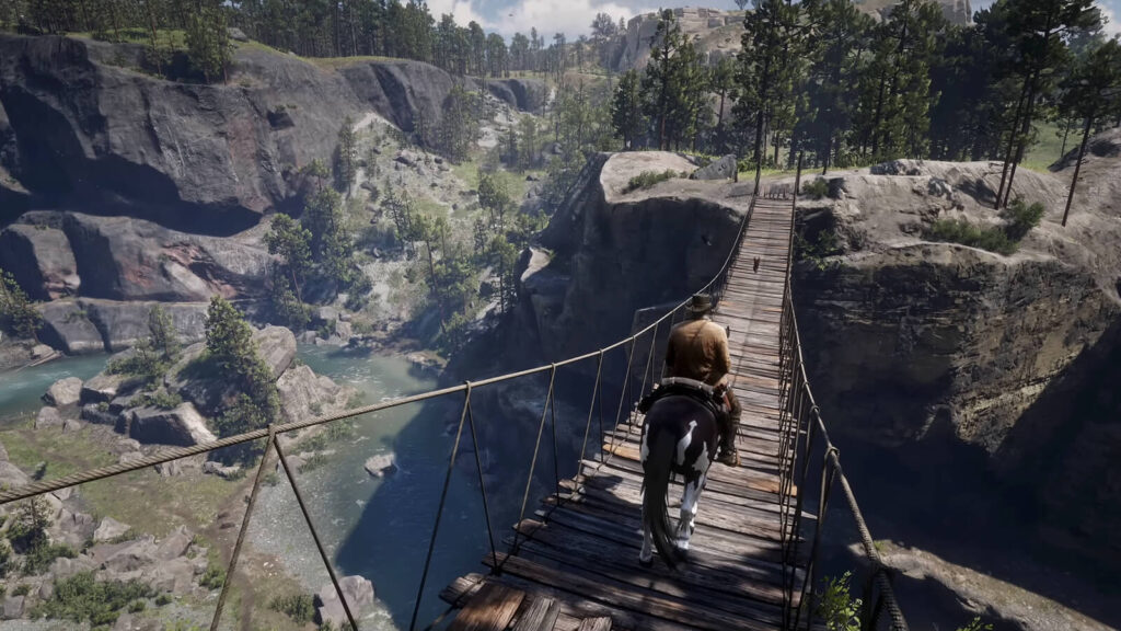 It’s Time to Admit Red Dead Redemption 2 Deserves a Full Remaster 3 Red Dead Redemption 2 screenshot featuring Arthur Morgan traversing a hanging bridge on horseback.