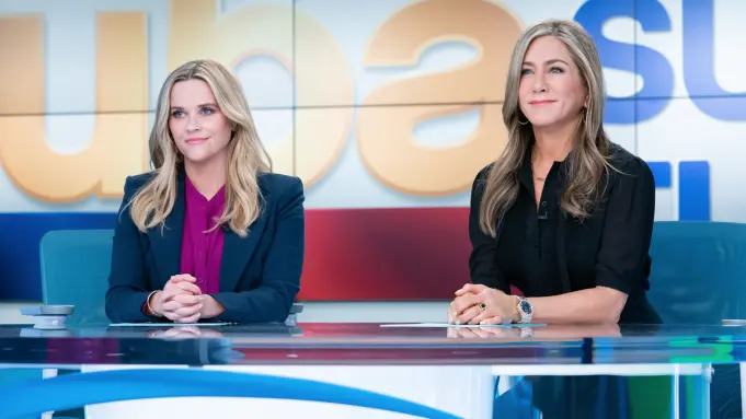 Reese Witherspoon and Jennifer Aniston, smiling.