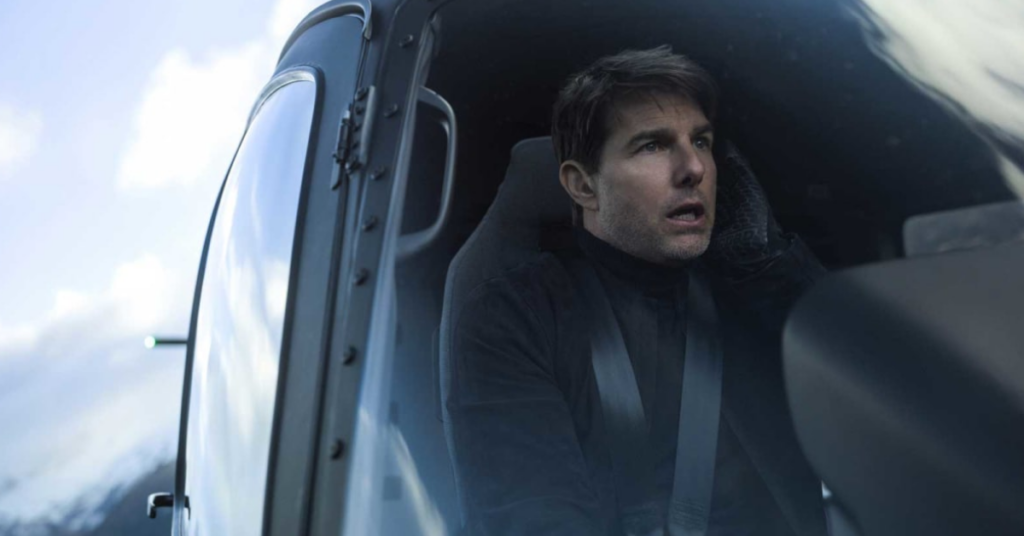 Tom Cruise sitting in an aircraft and looking out the glass in a still from Mission: Impossible - Fallout.