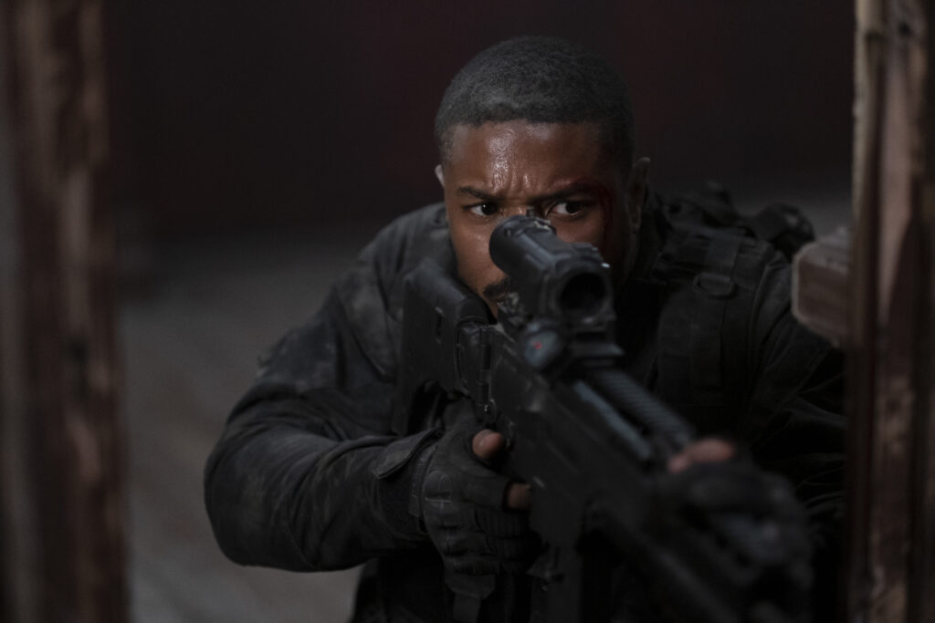 Taylor Sheridan Finds Redemption 4 Years Later With His Michael B. Jordan Movie That Was Wasted Potential 1 Michael B. Jordan stars in WITHOUT REMORSE Photo: Nadja Klier © 2020 Paramount Pictures holding a gun