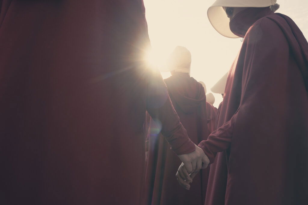 The Handmaid's Tale - Exodus - Handmaids walk through the streets and exchange weapons.