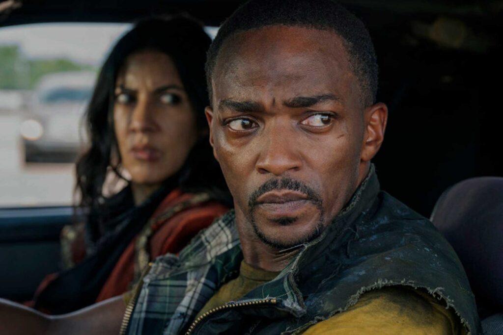 John and Quiet look angrily at an enemy