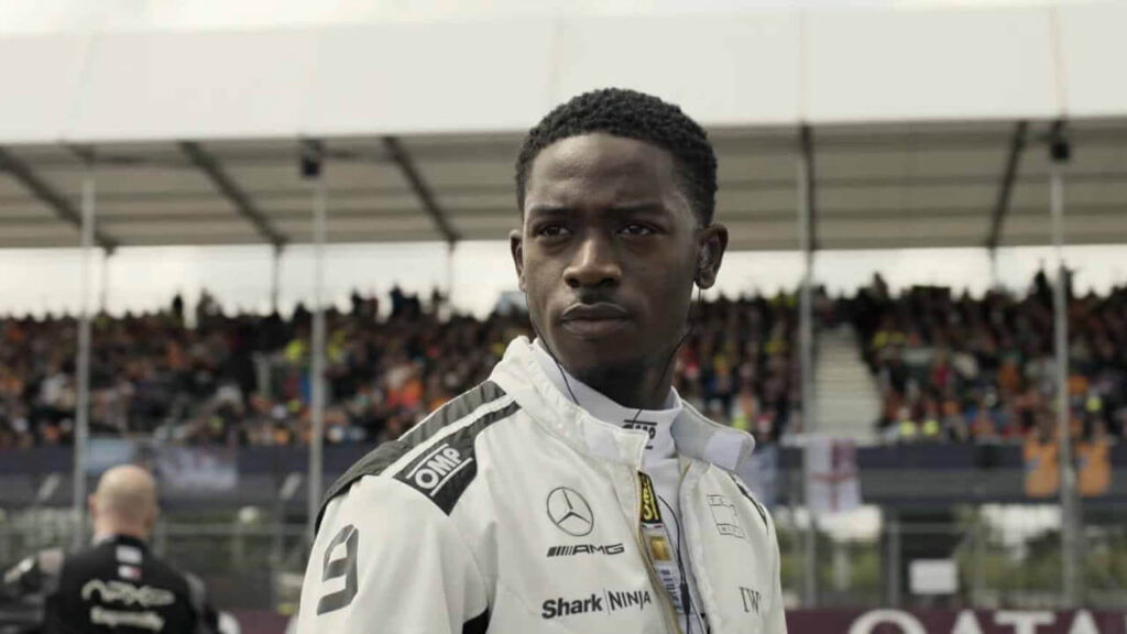 Damson Idris in racing attire in a still from F1
