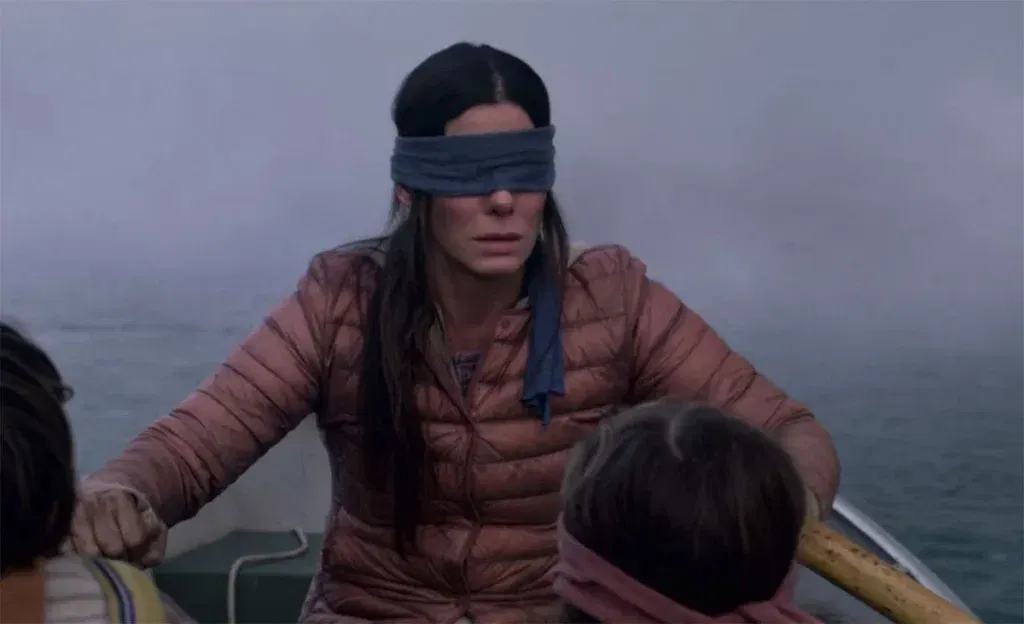 Sandra Bullock rows a boat blindfolded