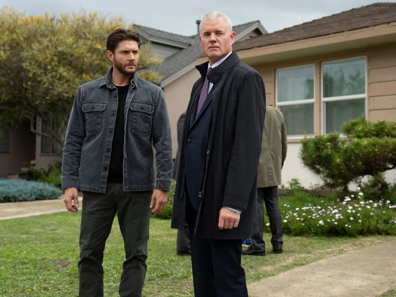 5 Movies and TV Shows Coming to Prime Video Next Month (June 2025) 6 Jensen Ackles and a suited co-star stand tensely outside a suburban home in a scene from Countdown season 1.