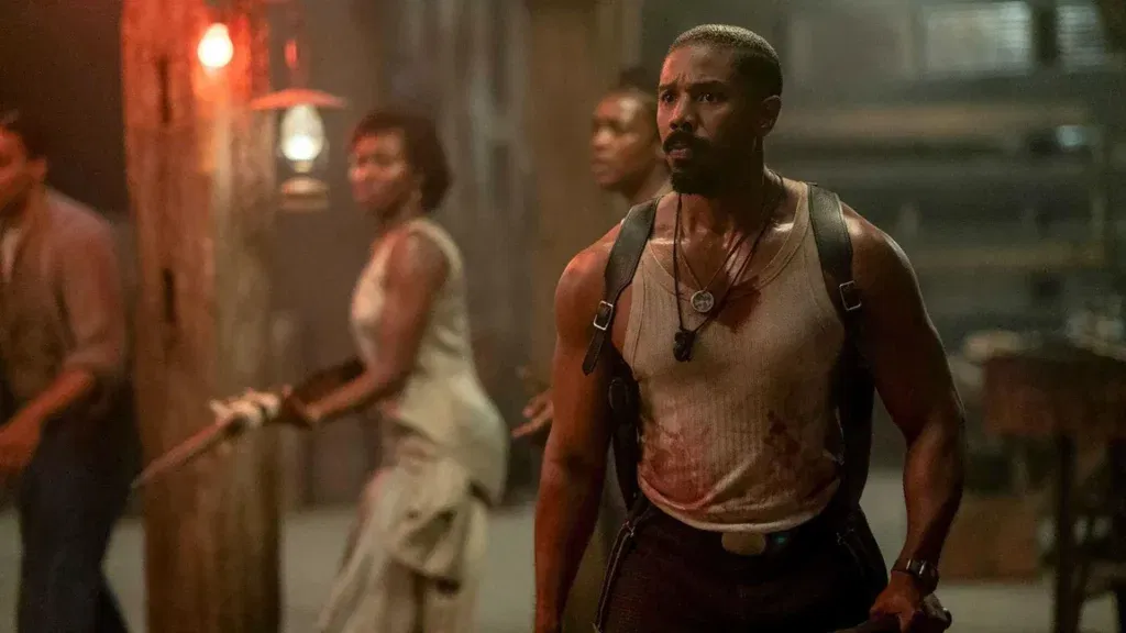 Michael B. Jordan with other background stars in a still from Sinners