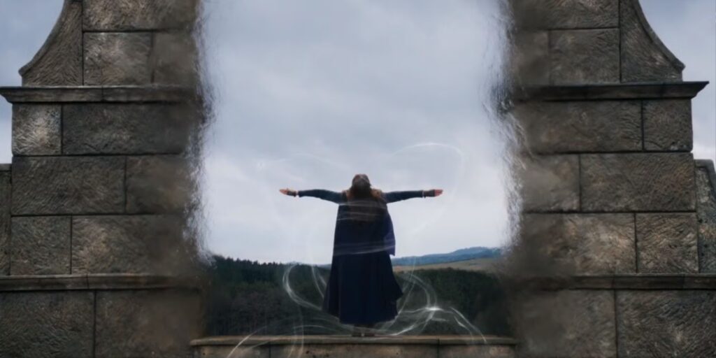 Brandon Sanderson “Won’t miss being largely ignored” After How ‘The Wheel of Time’ Discarded Him for Years 2 Rosamund Pike opening the portal as the Moiraine Damodred in The Wheel of Time.