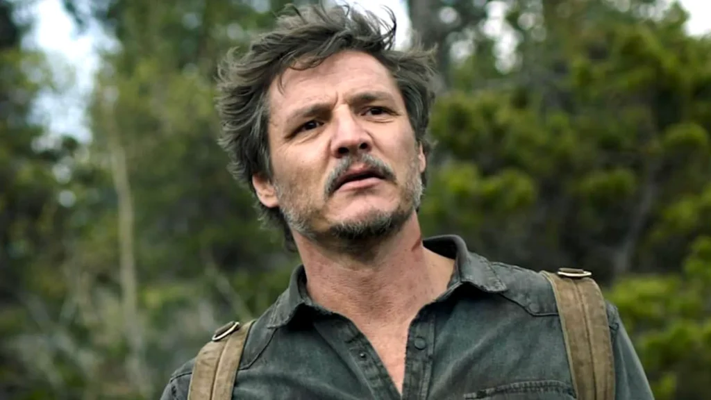 If You Hate This Brad Pitt Movie From 1994 Chris Evans Will Not Hesitate to End His Relationship With You 4 Pedro Pascal looking in the distance with a tired and wondering look on his face in The Last of Us.