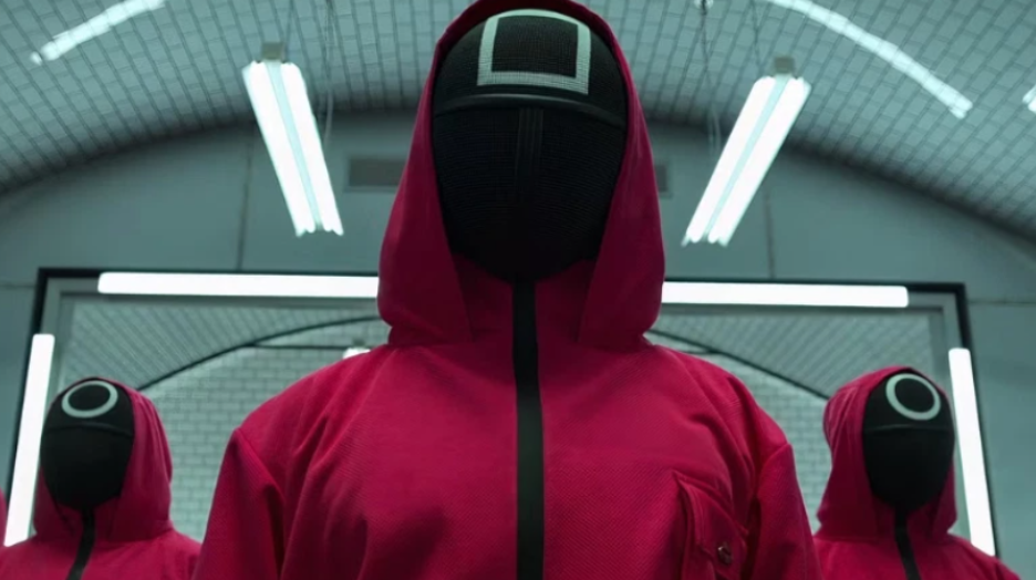 20 Absolutely Best TV Shows to Watch Right Now (June 2025) 23 Three pink guards are standing in a triangle.