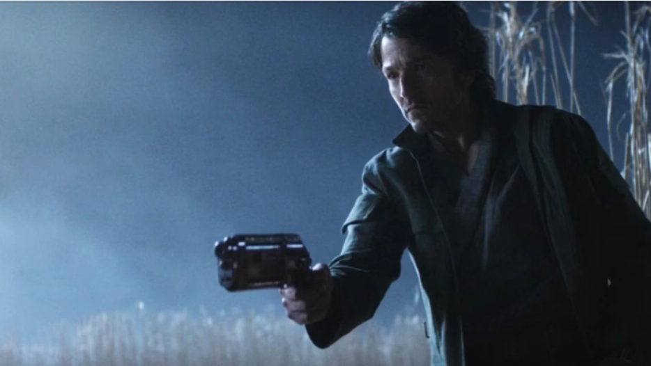 20 Absolutely Best TV Shows to Watch Right Now (June 2025) 8 Cassian is holding a blaster and looks ready to fight.