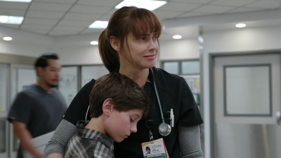 20 Absolutely Best TV Shows to Watch Right Now (June 2025) 14 Dr. McKay is holding a child who looks sad. McKay looks like she is crying.