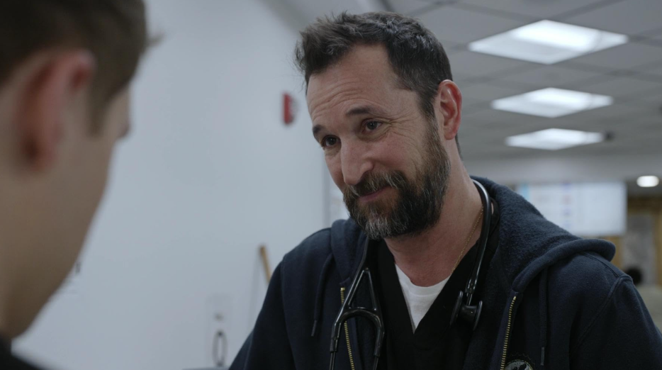 20 Absolutely Best TV Shows to Watch Right Now (June 2025) 15 Dr. Michael is smiling at someone. His expression is full of warmth.