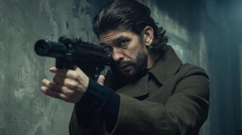 20 Absolutely Best TV Shows to Watch Right Now (June 2025) 29 Sam is pointing a gun at someone.