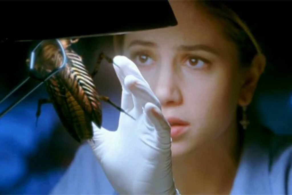 12 Best Guillermo del Toro Movies to Watch Before ‘Frankenstein’ on Netflix 1 Mira Sorvino as Susan with an insect under the light in a still from Guillermo del Toro's Mimic.