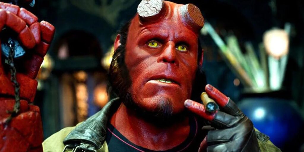12 Best Guillermo del Toro Movies to Watch Before ‘Frankenstein’ on Netflix 3 Ron Perlman as Hellboy smoking a cigar.