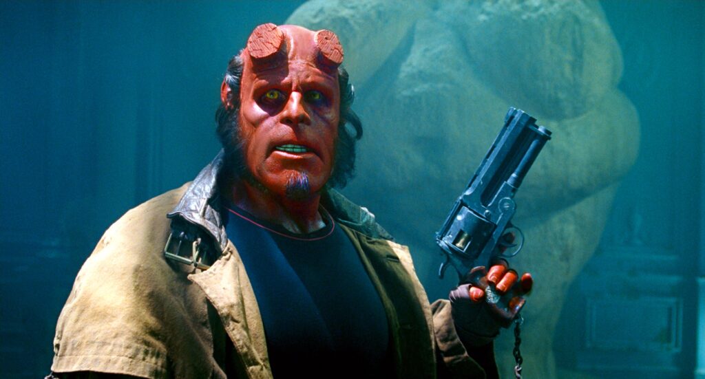 12 Best Guillermo del Toro Movies to Watch Before ‘Frankenstein’ on Netflix 14 Hellboy with a gun in his hands.