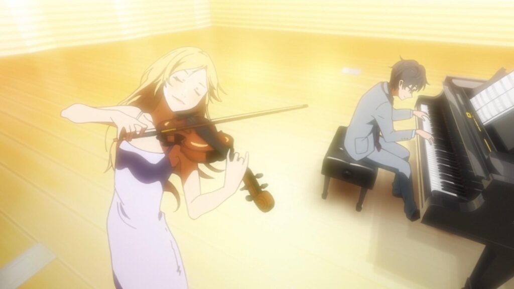 Kosei is on the piano and Kaori is playing the violin in a still from Your Lie in April.
