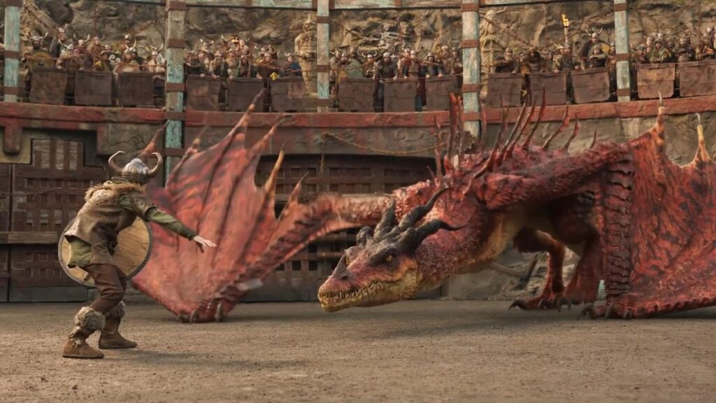 How To Train Your Dragon: How Does the New Movie Differ From the Animated Classic? 3 A still from How To Train Your Dragon (2025) featuring Hiccup fighting a red dragon called the Monstrous Nightmare in a battle arena