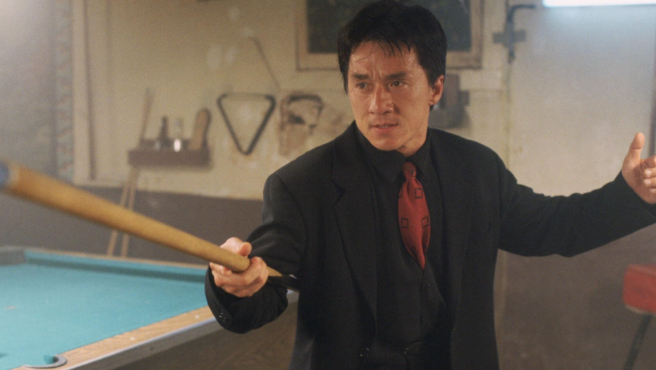 Lee is pointing a pool stick at someone, ready to fight.
