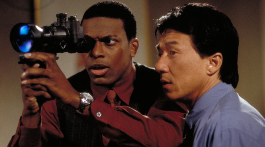Carter is using a camera to look at something, while beside him, Lee is trying to see the same thing with his bare eyes.