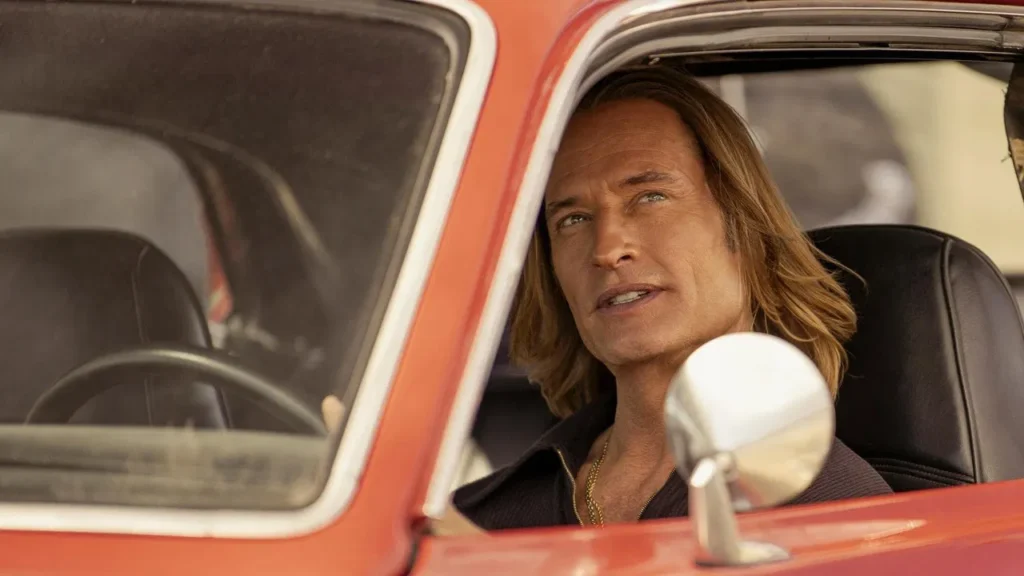 Josh Holloway driving a car while looking outside the window