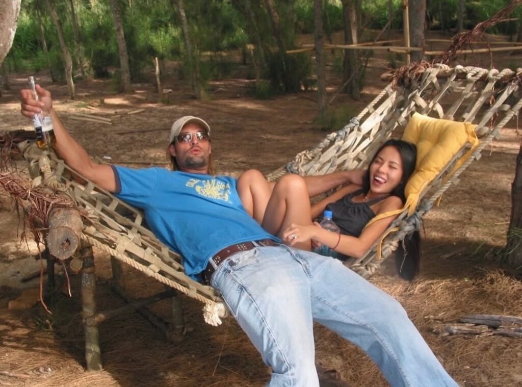 Josh Holloway and Yessica laying down on a hammock
