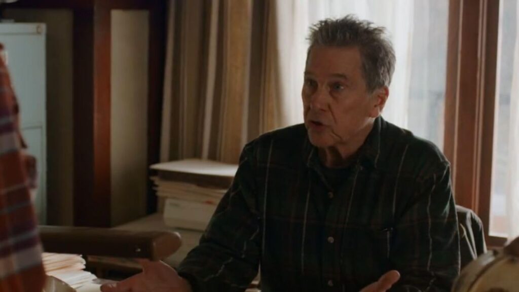 'Virgin River' Season 7: Everything We Know So Far 10 Tim Matheson talking to someone while sitting at a desk.
