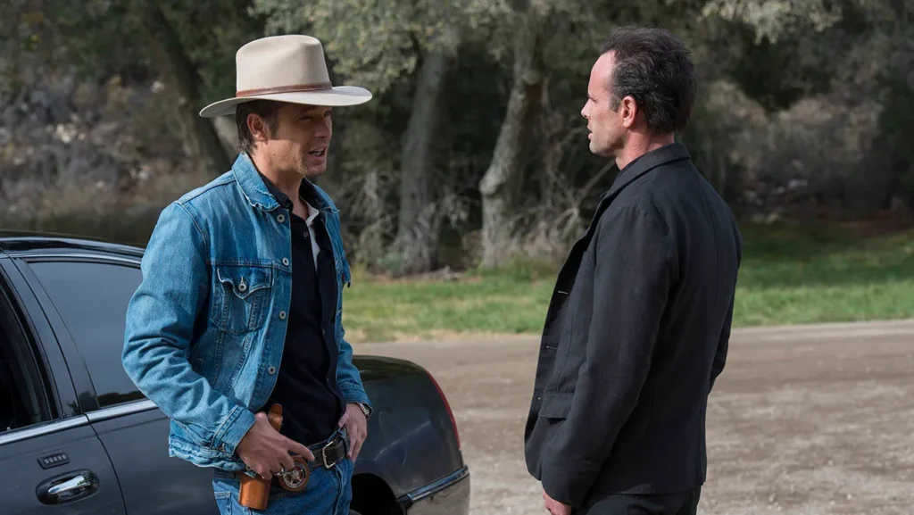 While You Wait for ‘Slow Horses’ Season 5, It’s a Good Time to Visit a Similar 97% Rated Show Starring Timothy Olyphant 7 Timothy Olyphant and Walton Goggins in a scene from Justified