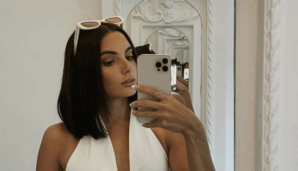 Summer House: Why Did Paige Leave After 7 Seasons? 2 Paige DeSorbo clicking a mirror selfie.