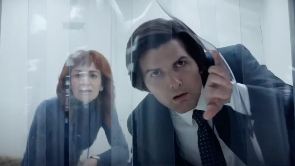 20 Absolutely Best TV Shows to Watch Right Now (June 2025) 54 Helly and Mark crouching while Mark slides plastic transparent curtains.