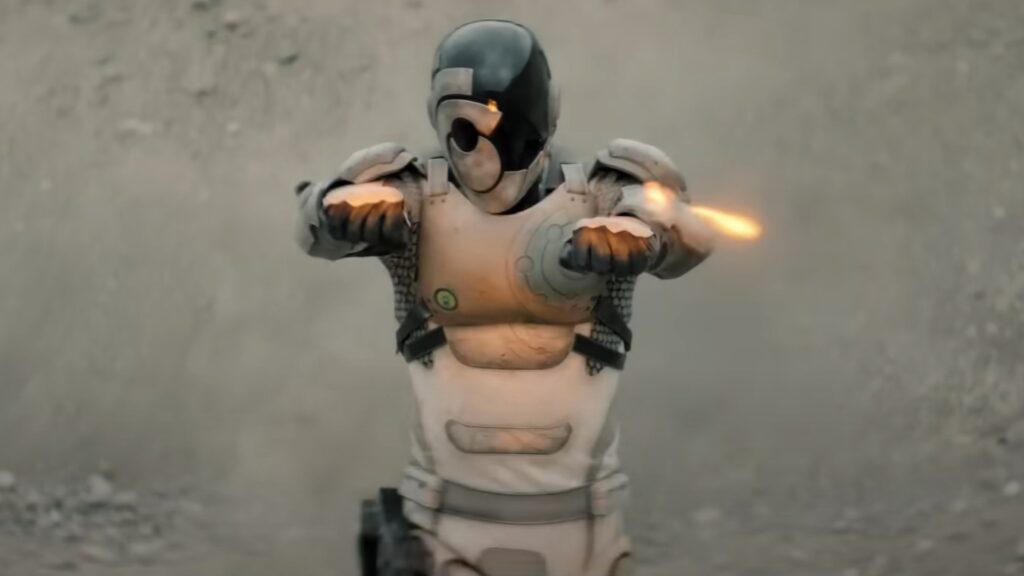 20 Absolutely Best TV Shows to Watch Right Now (June 2025) 62 Murderbot hovers with arms extended and orange glowing elements emanating from the hands.