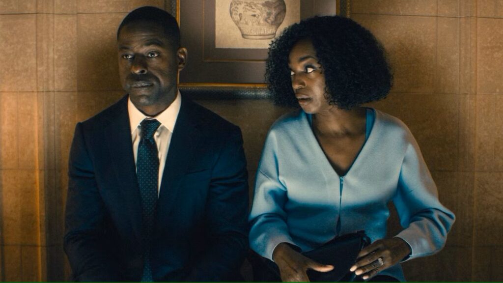 20 Absolutely Best TV Shows to Watch Right Now (June 2025) 73 Xavier Collins in a dark suit and Dr. Teri Rogers-Collins in a light blue blazer sit together and are having a conversation.