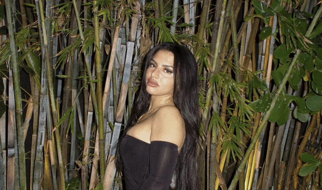 ‘Love Island USA’ Season 7: Huda’s Ex Fires Back at Claims He’s a No-Show Dad 2 Huda Mustafa from Love Island, wearing a black dress.