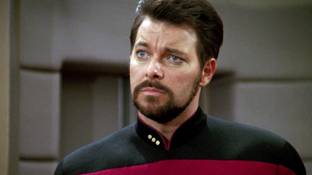 ‘Star Trek: The Next Generation’ Cast: What Are They Doing in 2025? 2 Commander William Riker looking at someone in Star Trek: TNG