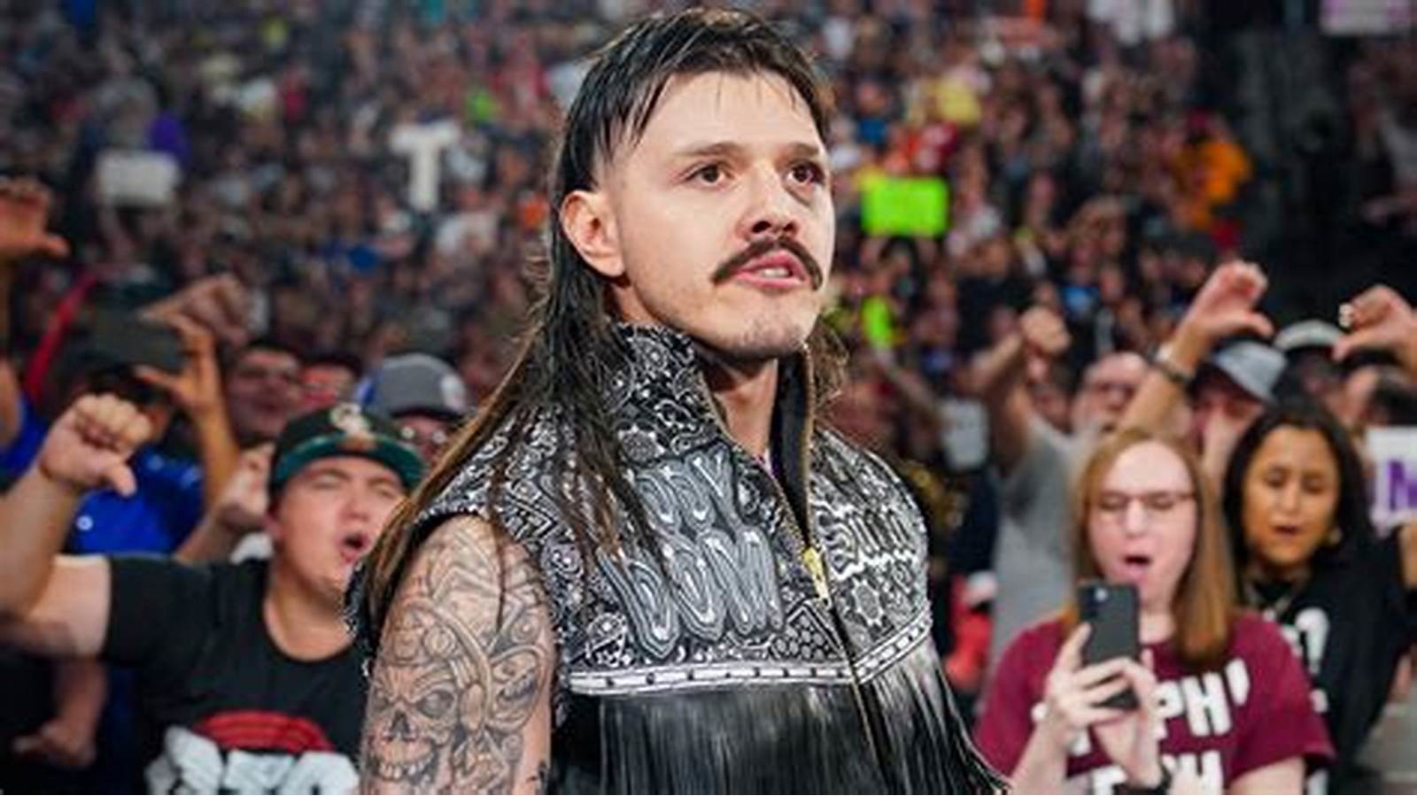 Dominik Mysterio entering the ring. 
