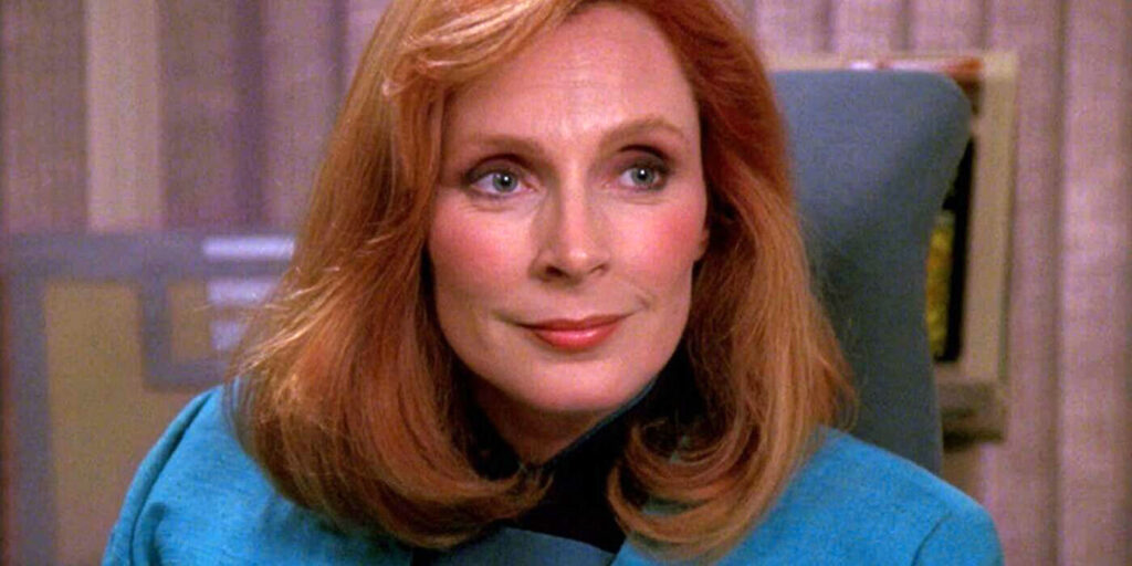 ‘Star Trek: The Next Generation’ Cast: What Are They Doing in 2025? 7 Dr. Beverly Crusher smiling in Star Trek: TNG